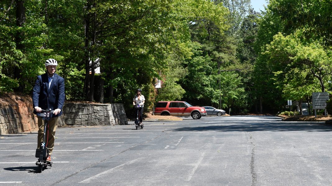 Peachtree Corners riders on scooters