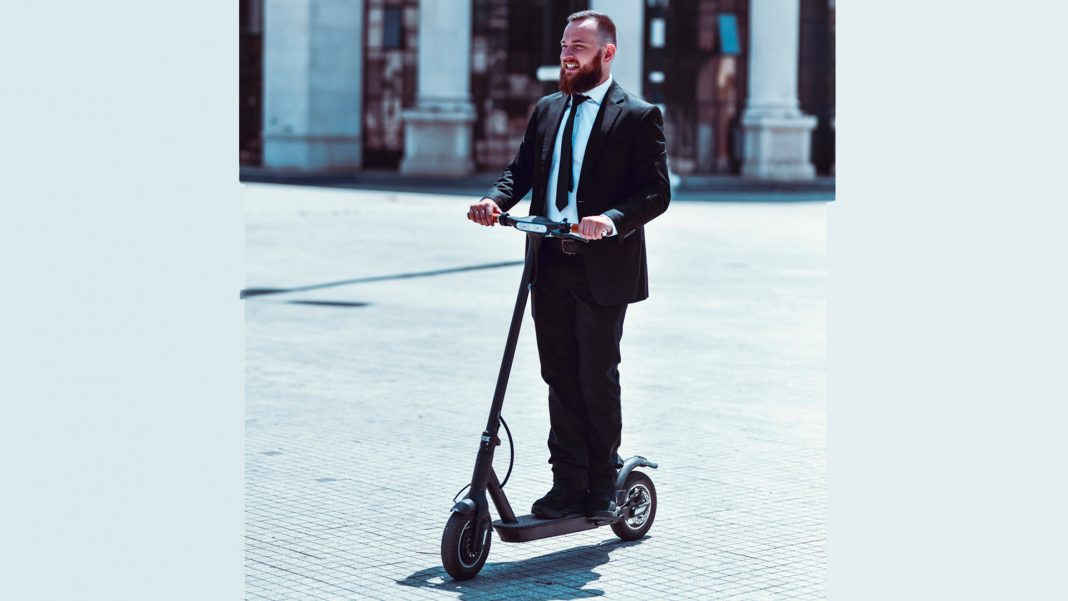 Businessman on e-scooter