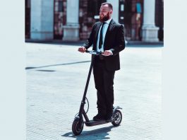 Businessman on e-scooter